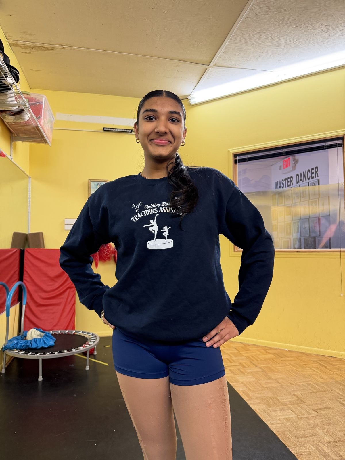 A senior teacher assistant in her Guiding Stars sweatshirt