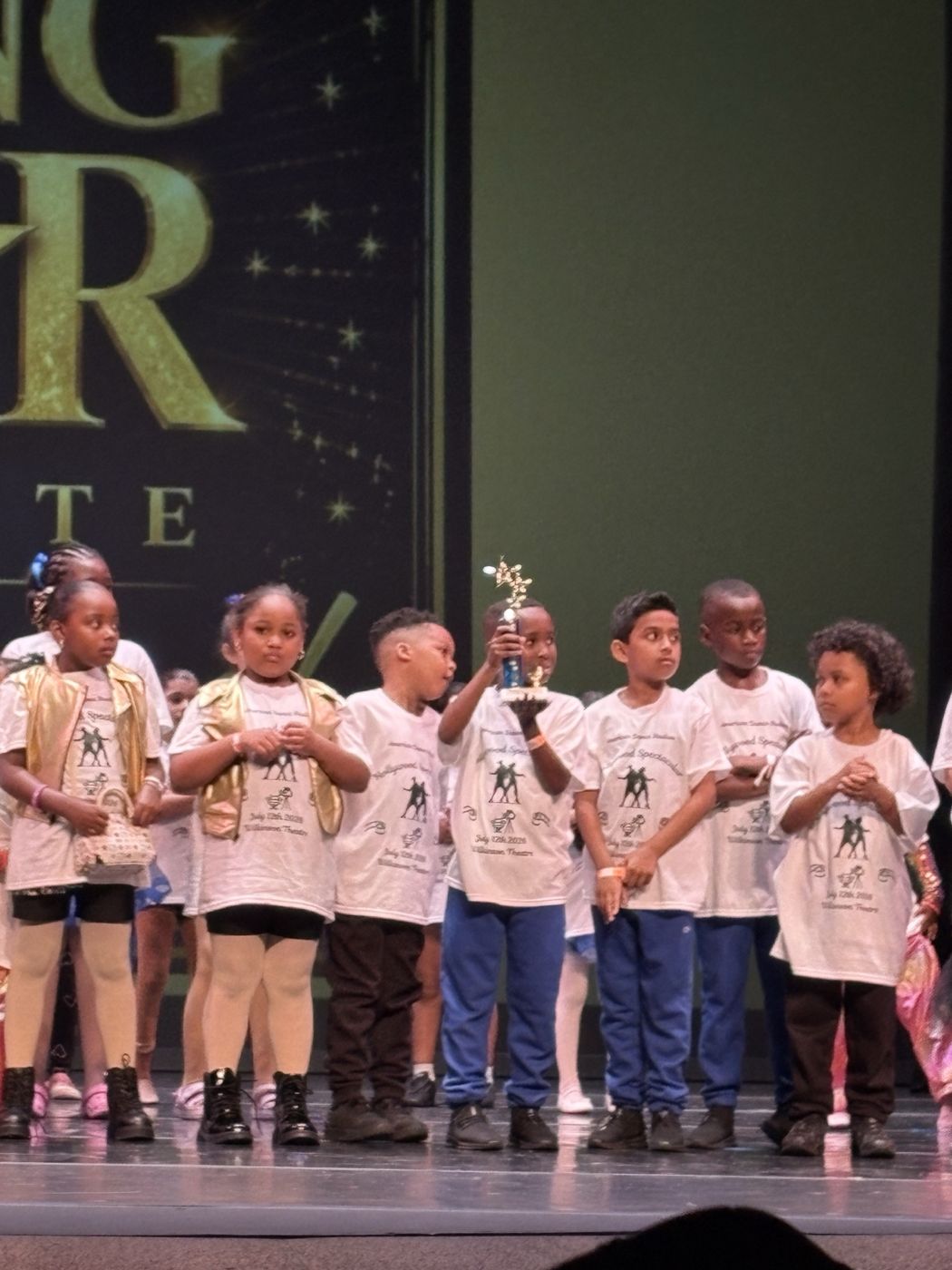 Rhythm Crew and young company dancers on stage at the studio show